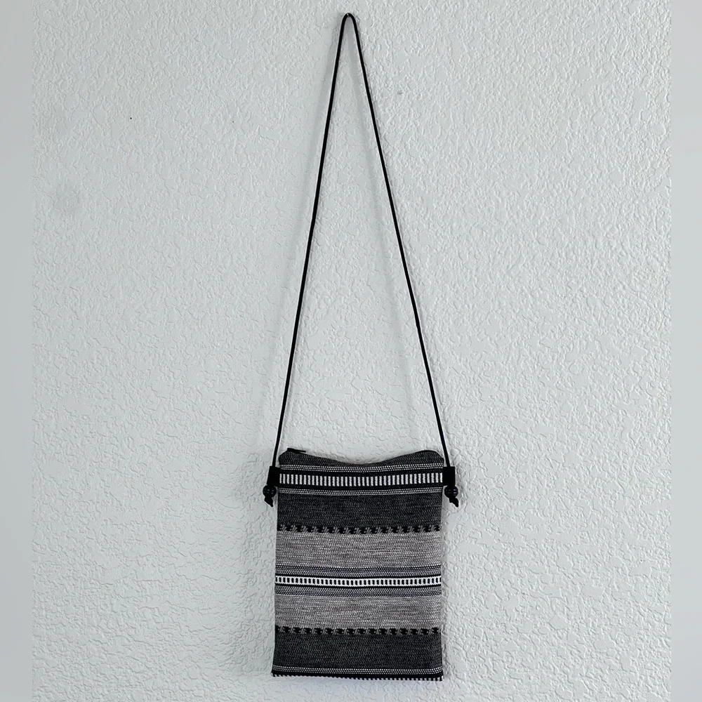 Like new black and white woven crossbody bag small